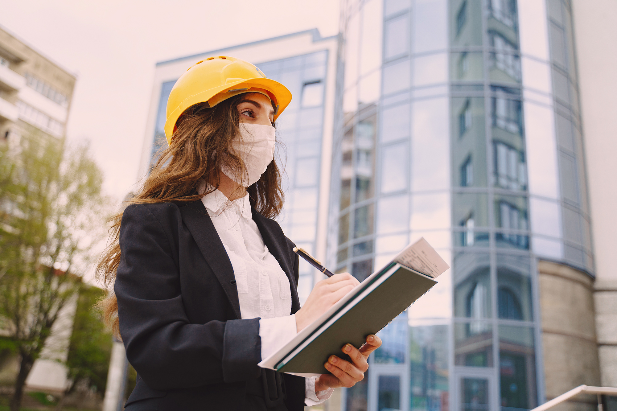 female-architect-with-construction-site-on-the-bac-9NHCLNS