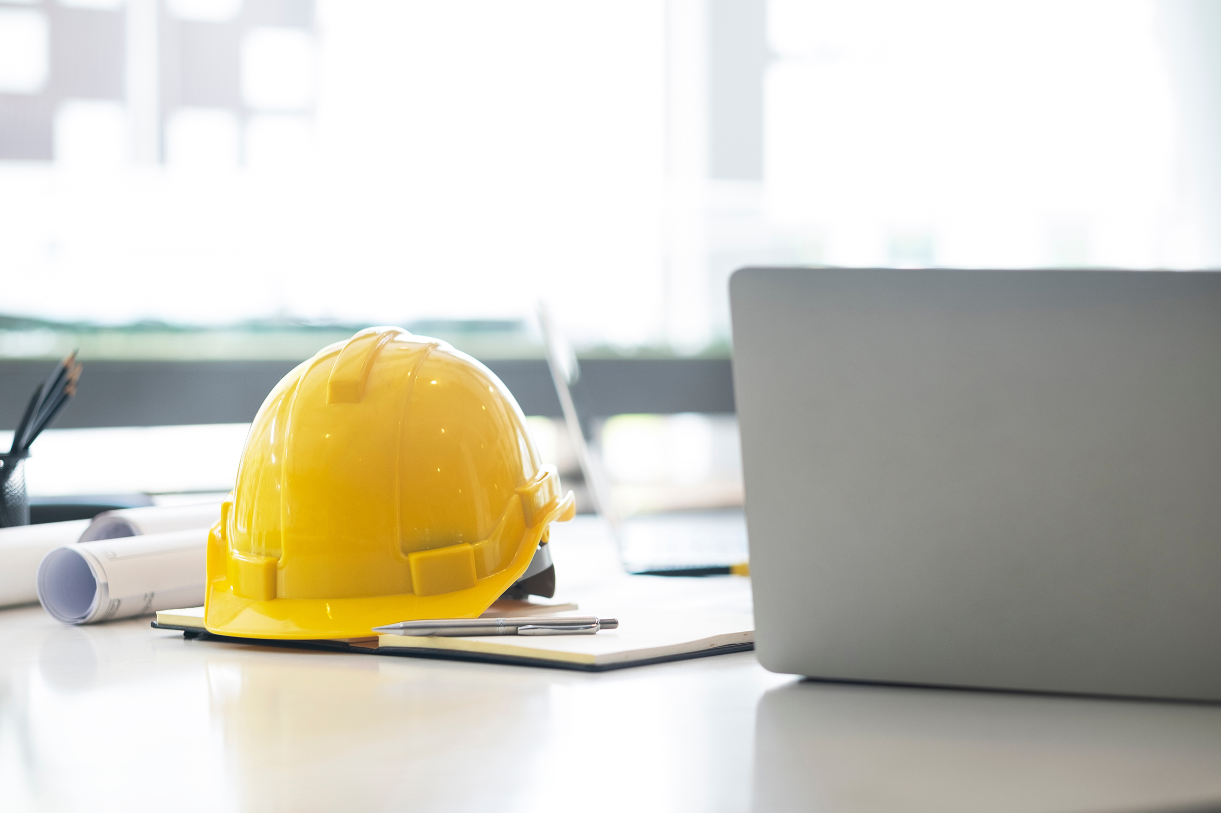 engineer-construction-office-computer-desk-UF4CVHH construction documents hat
